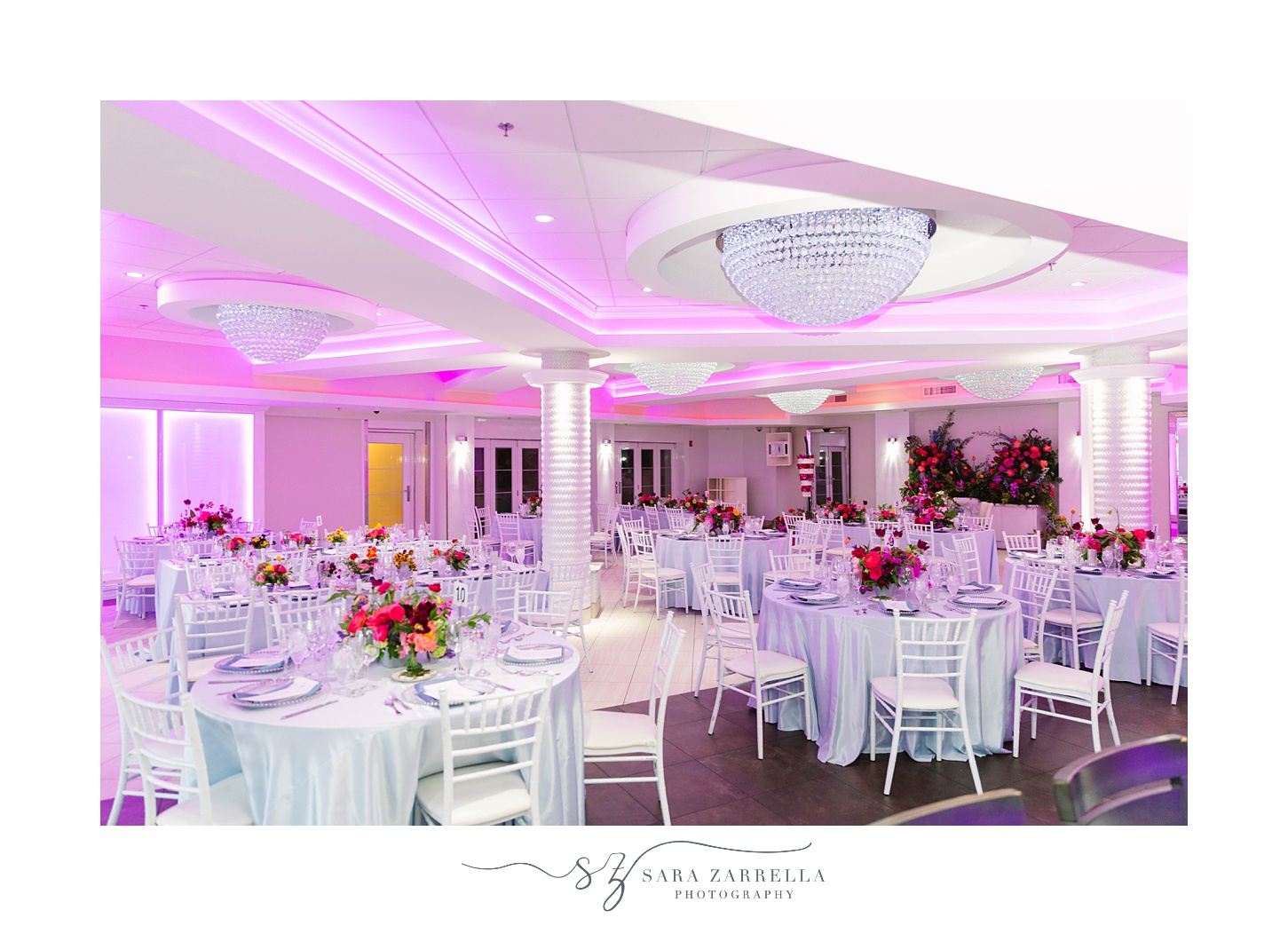 wedding reception with white table cloths and pink flowers at Skyline at Waterplace