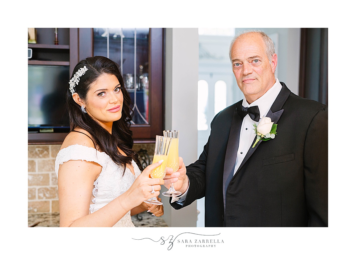 bride and dad toast with mimosas on RI wedding day