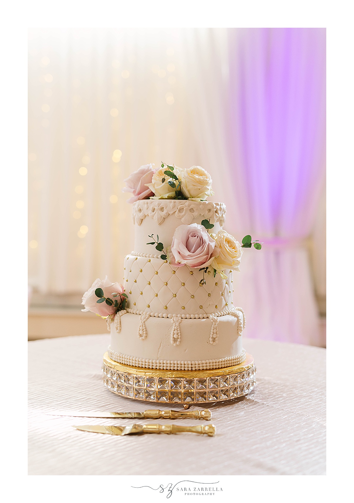 tiered wedding cake with floral accents at  Alpine Country Club reception
