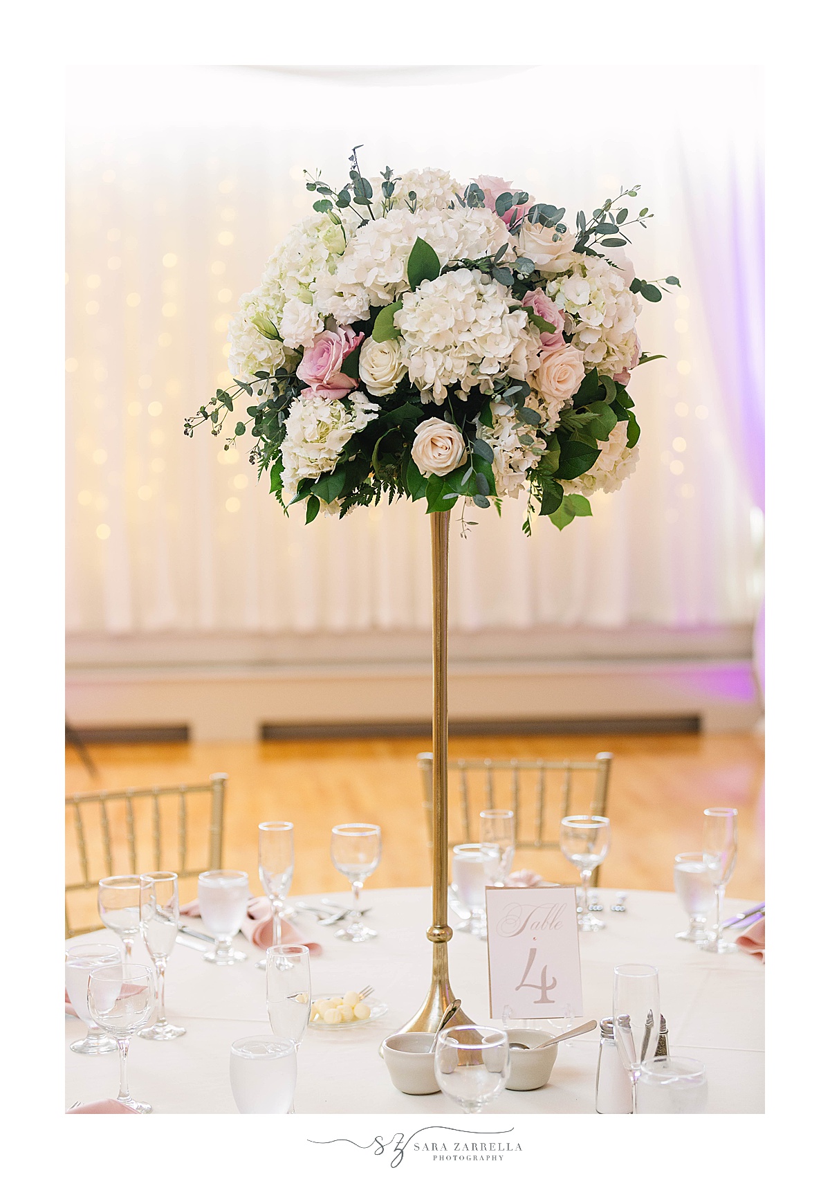 tall centerpiece with white and pink flowers