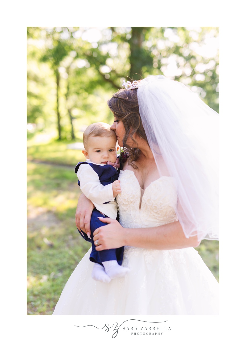 bride kisses son during MA wedding photos 