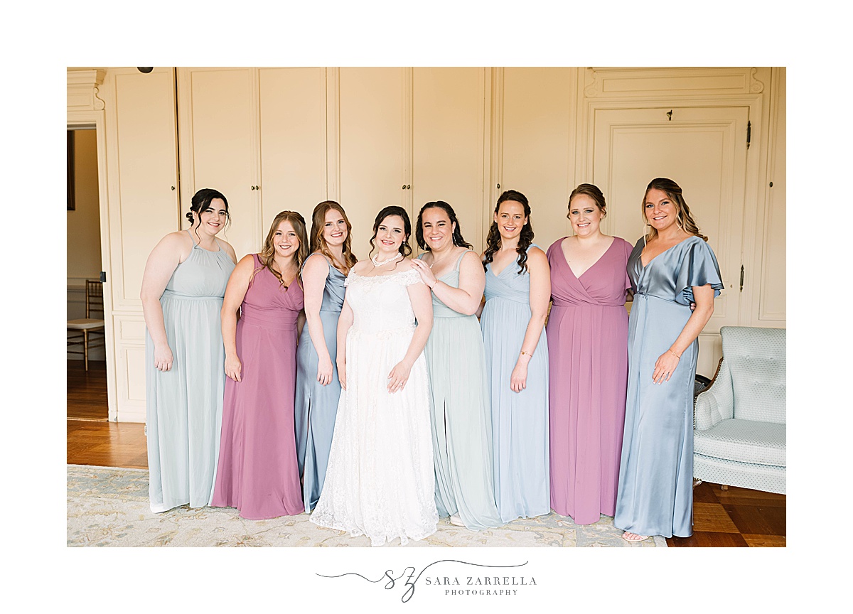 bridesmaids pose with bride in wedding suite at Glen Manor House