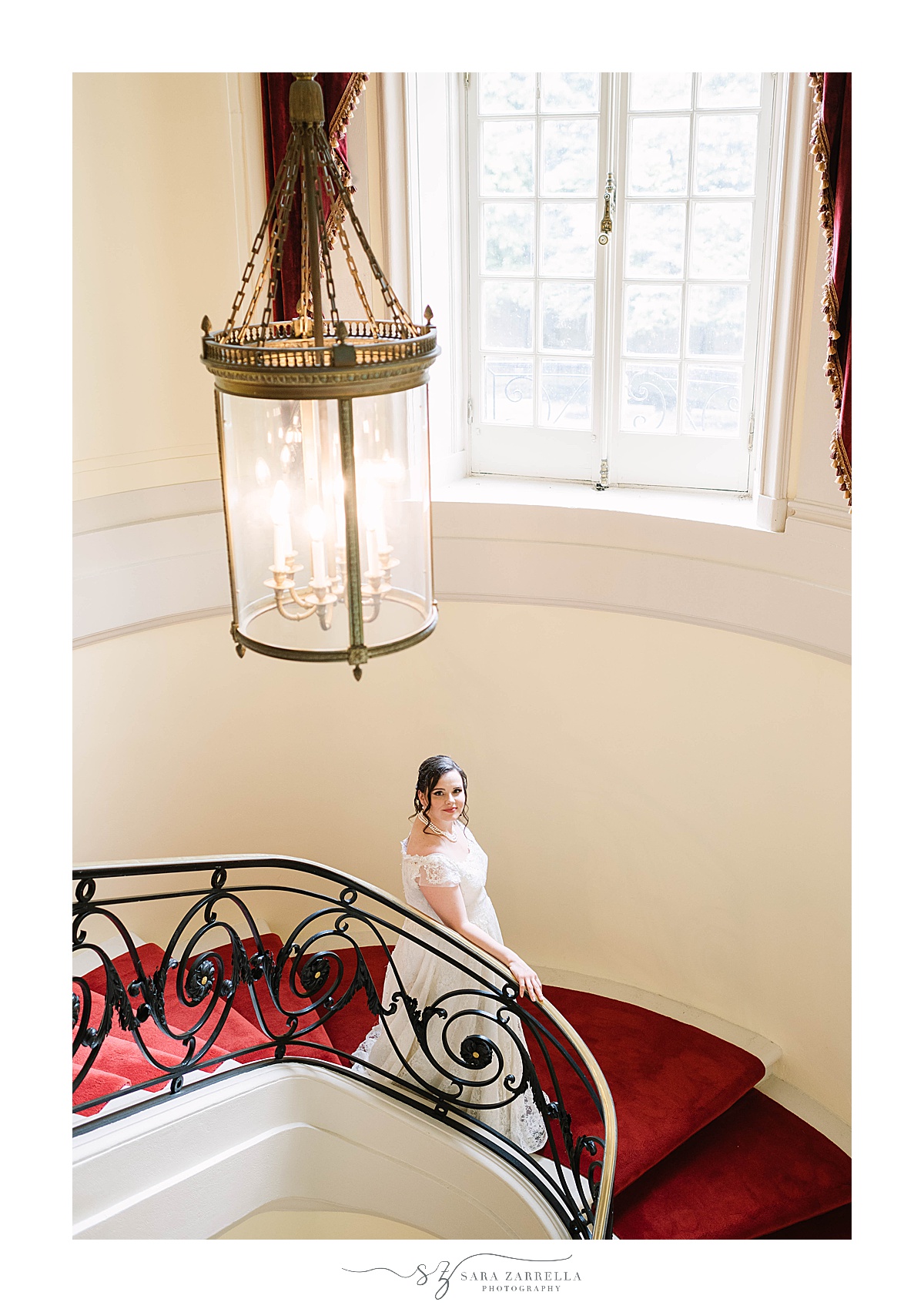 bride walks down staircase in Glen Manor House
