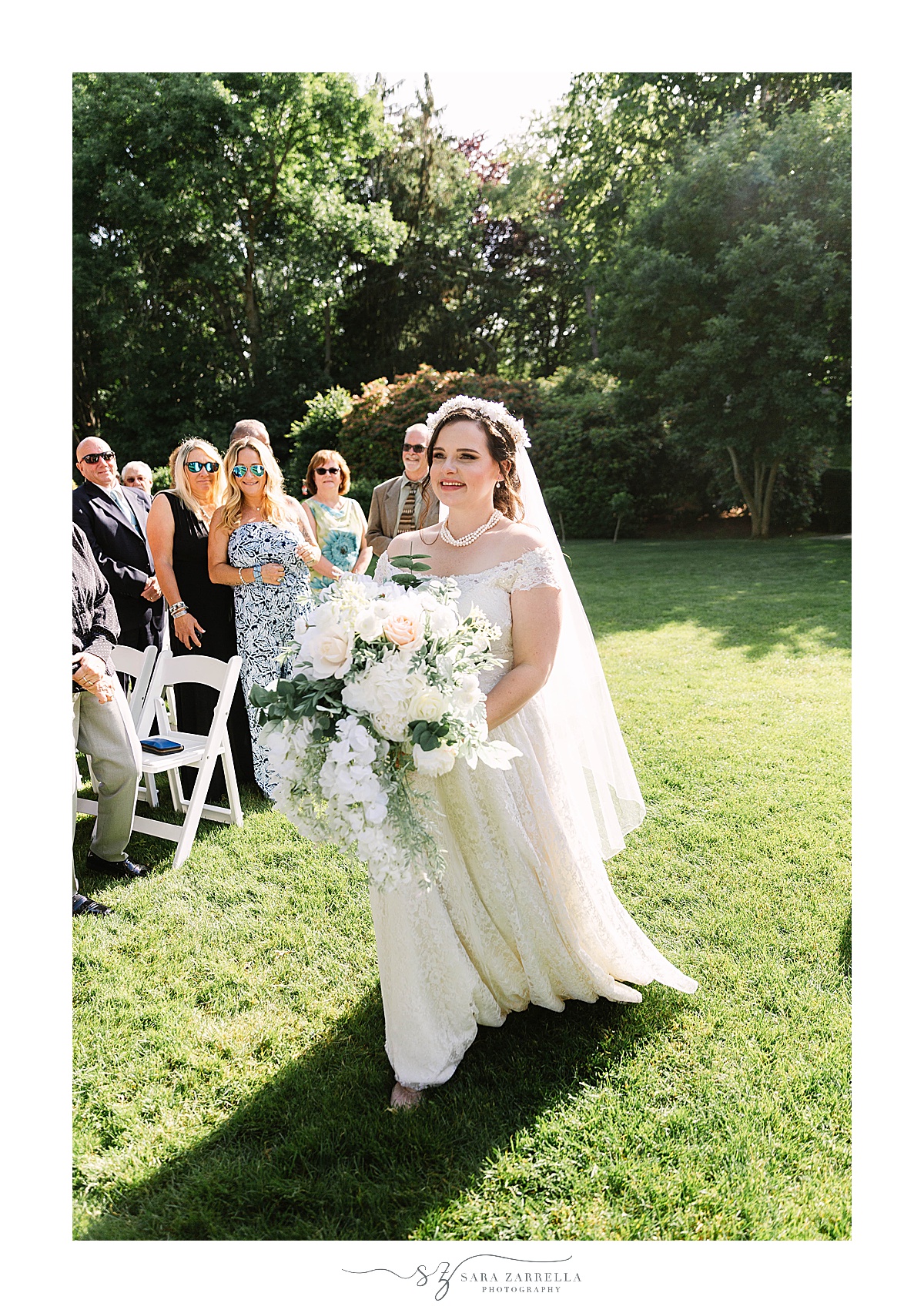 bride walks down aisle at Glen Manor House