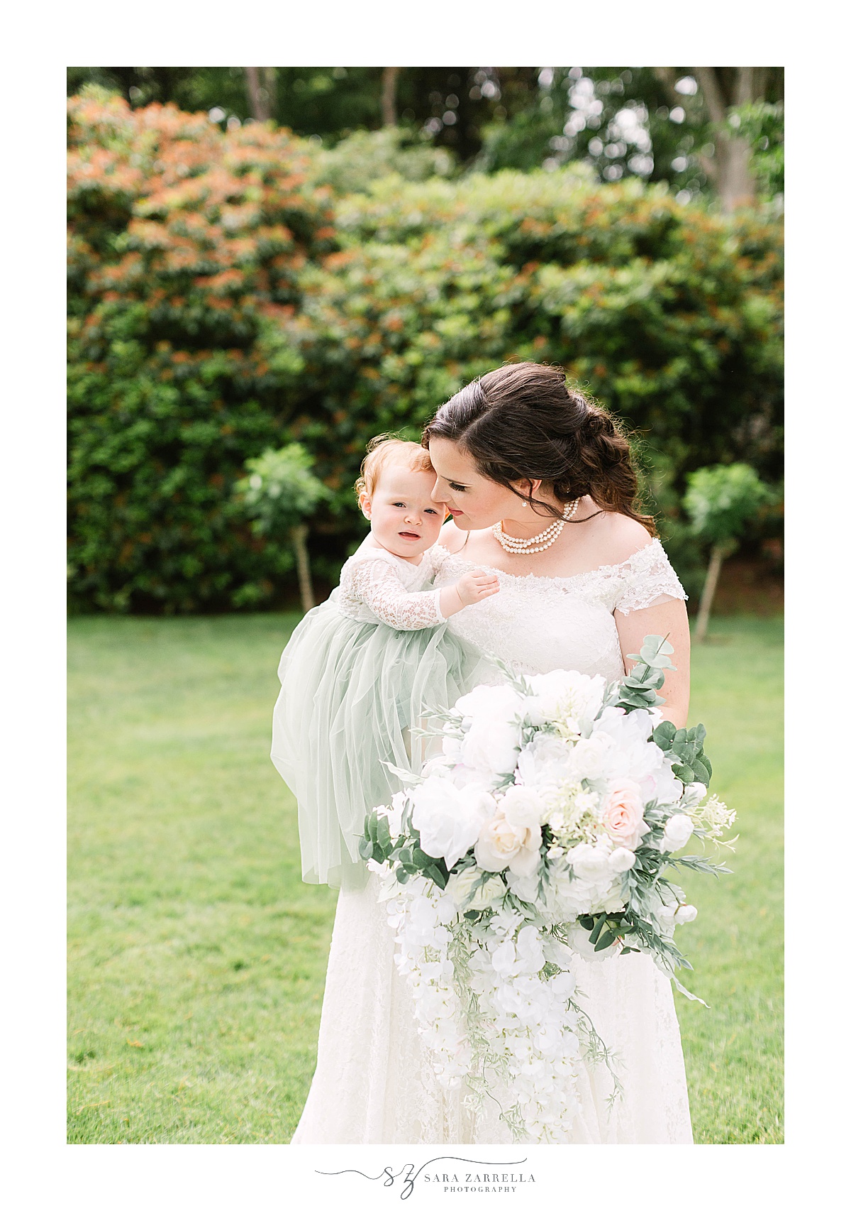 bride hugs little girl on wedding day at Glen Manor House