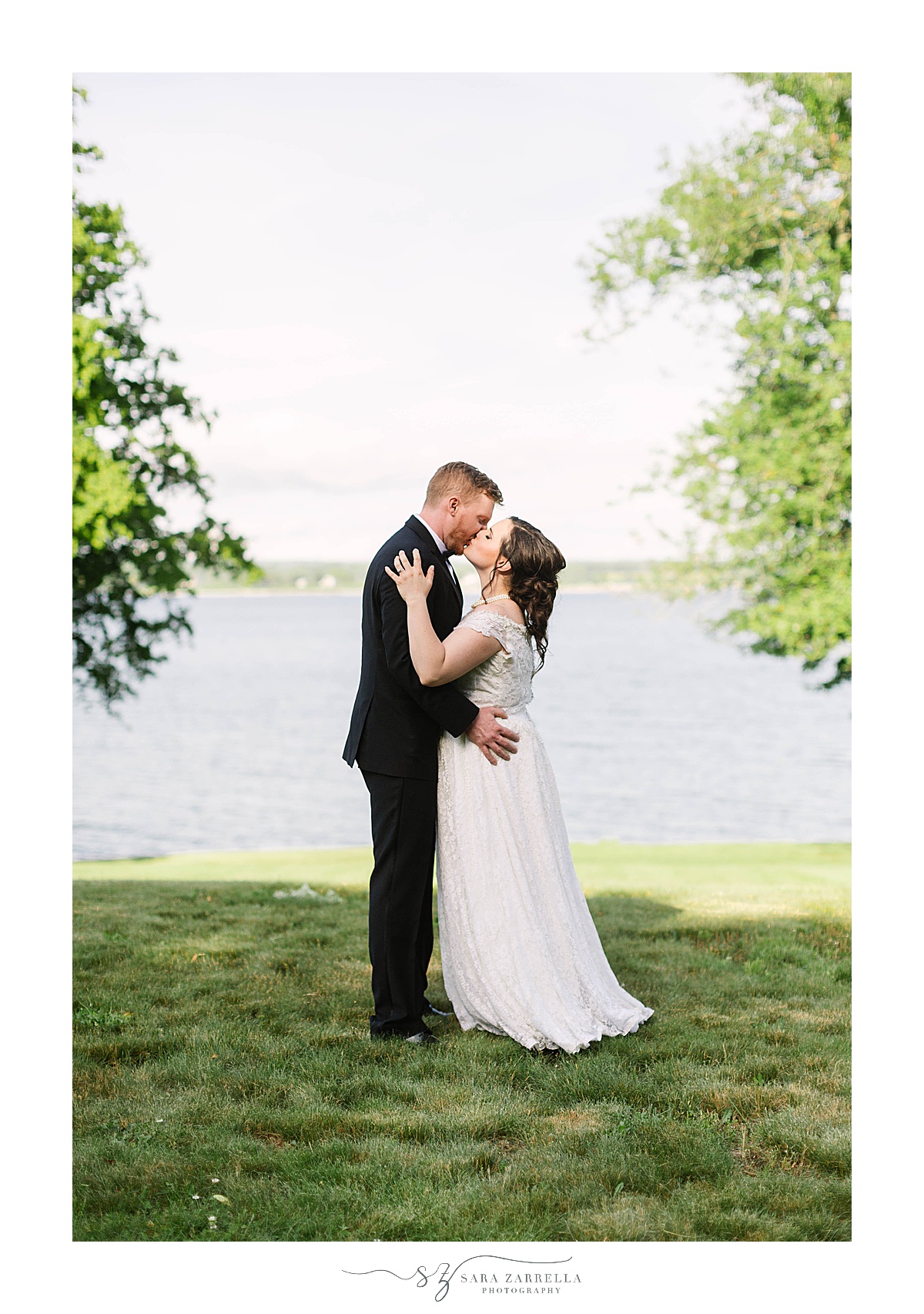 newlyweds kiss during RI wedding photos at Glen Manor House