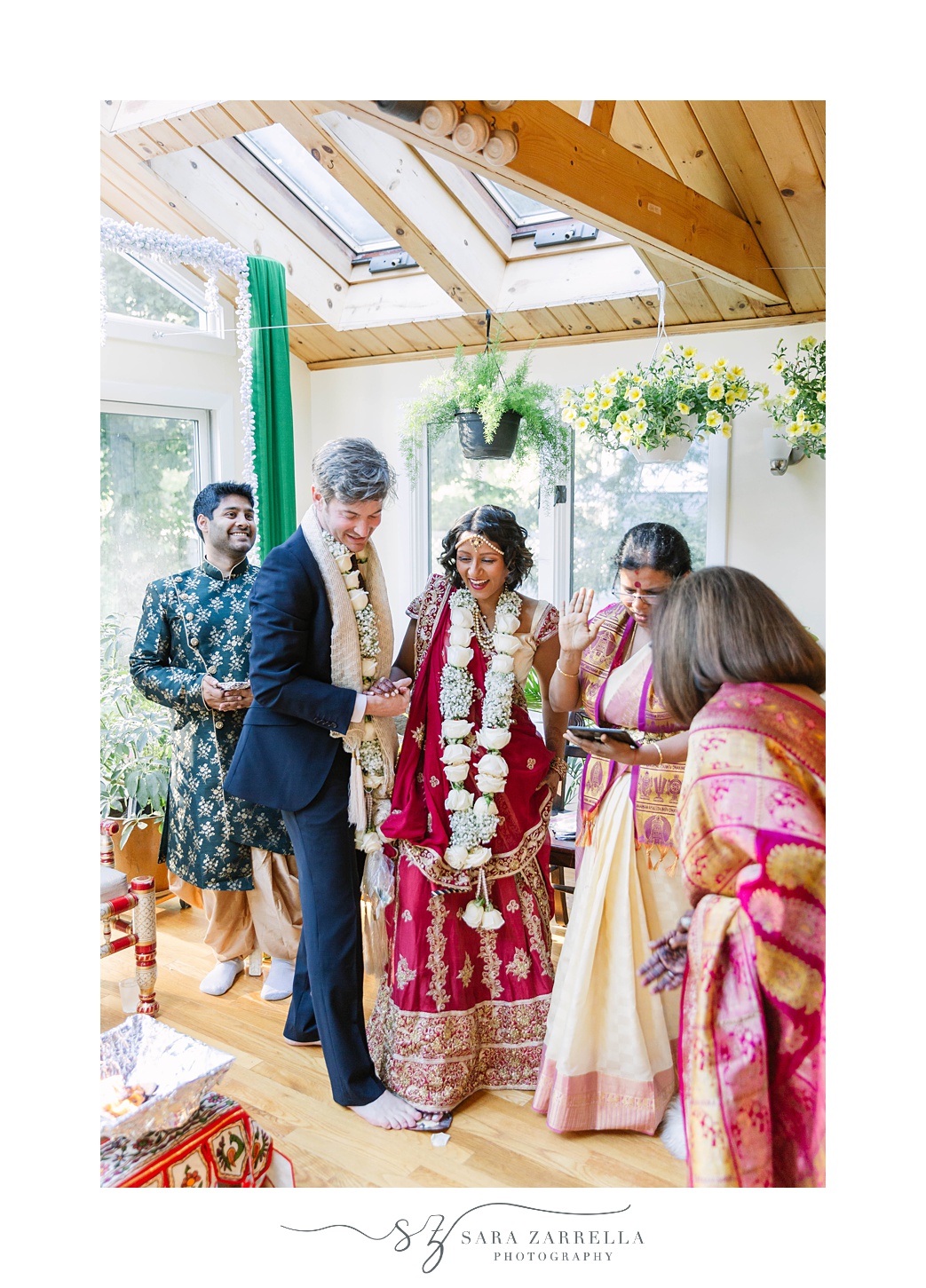 newlyweds walk circle during intimate Hindu wedding ceremony at home