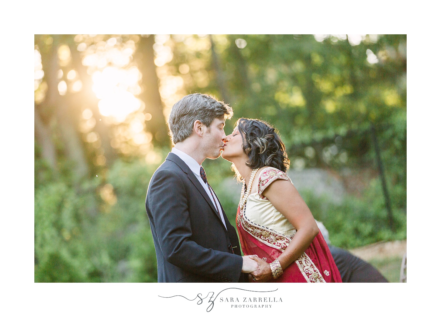 newlyweds kiss during portraits at home