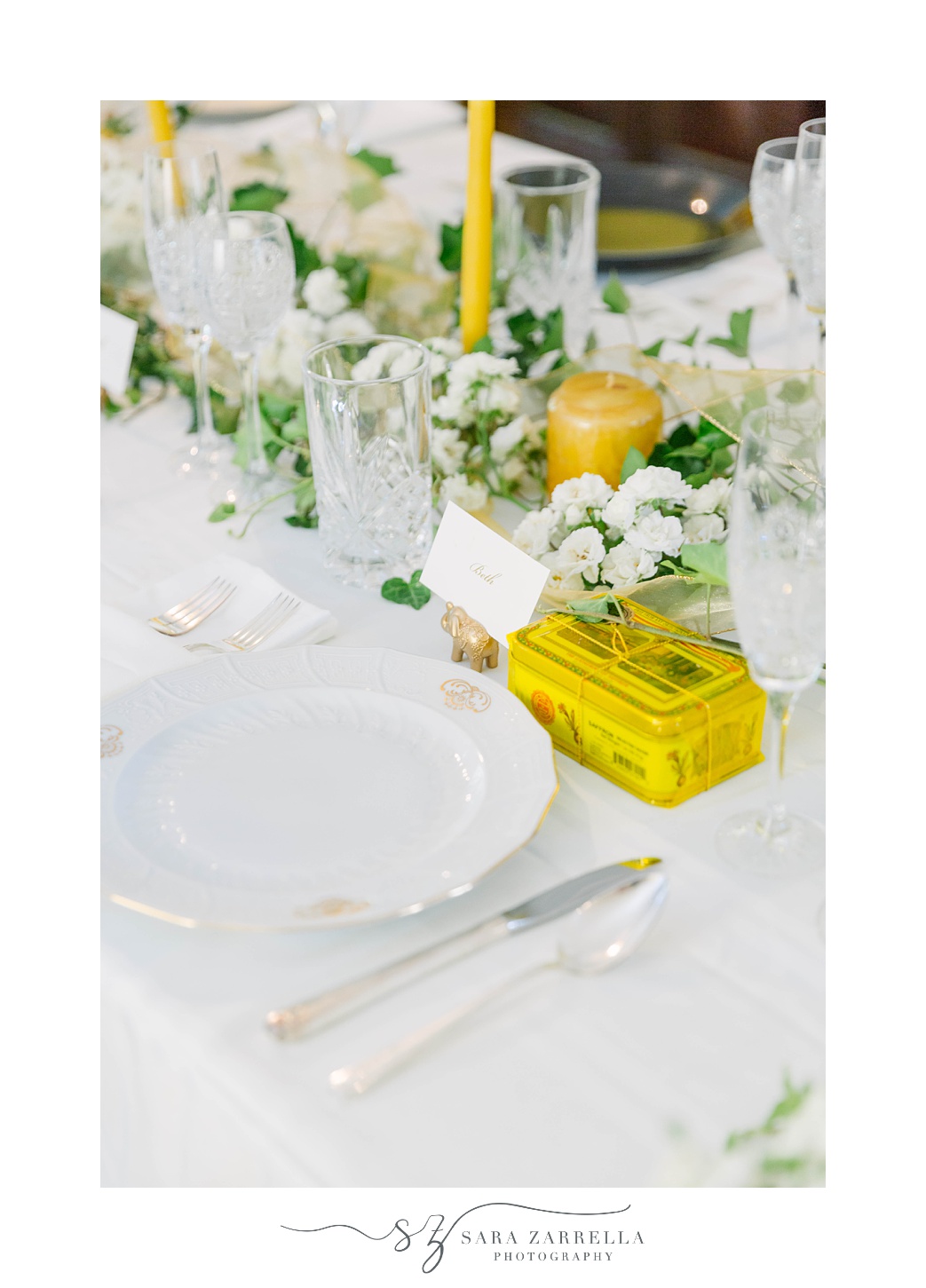 gold and white place settings for MA reception at home 