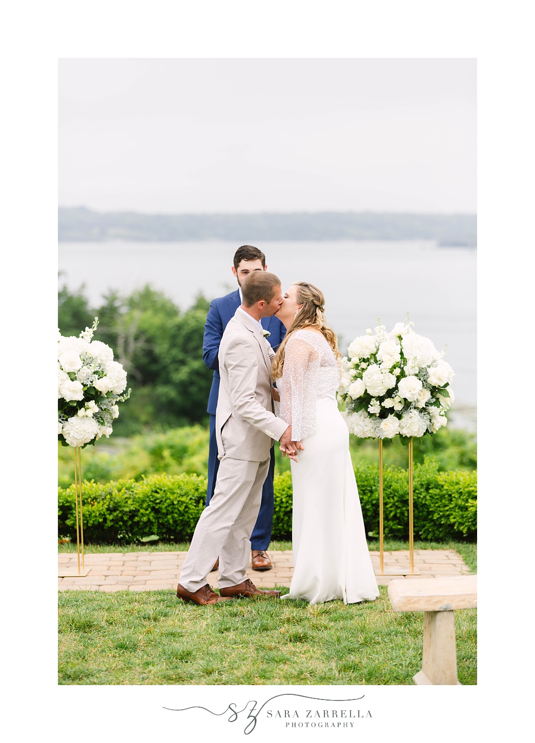 bride and groom kiss during RI wedding ceremony photographed by Rhode Island wedding photographer Sara Zarrella Photography 