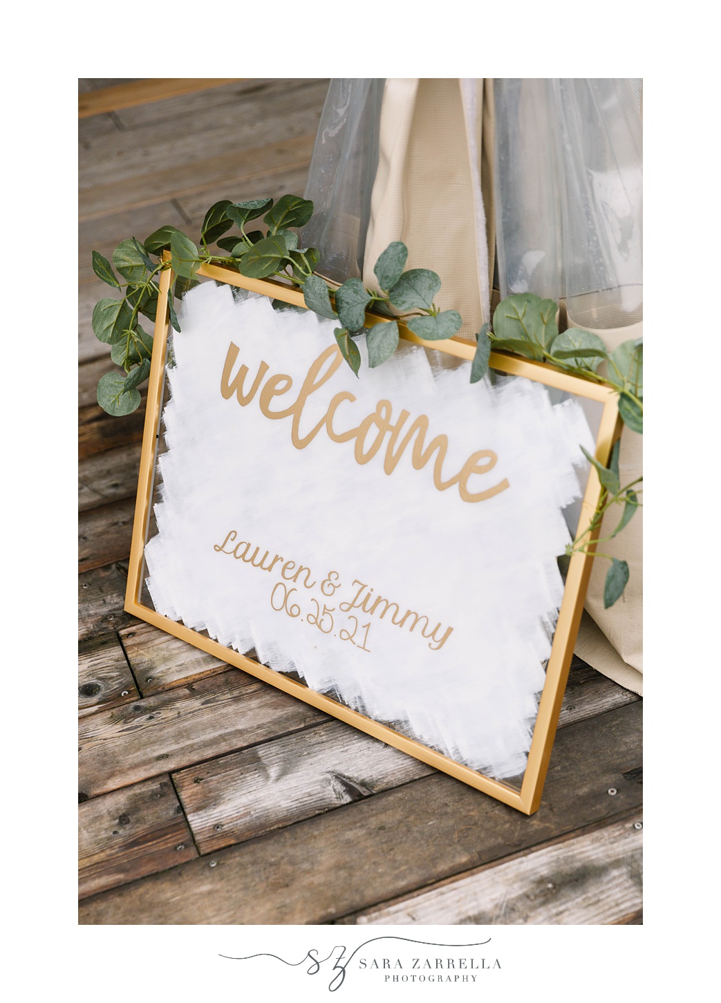 gold welcome sign for OceanCliff Hotel brunch wedding reception