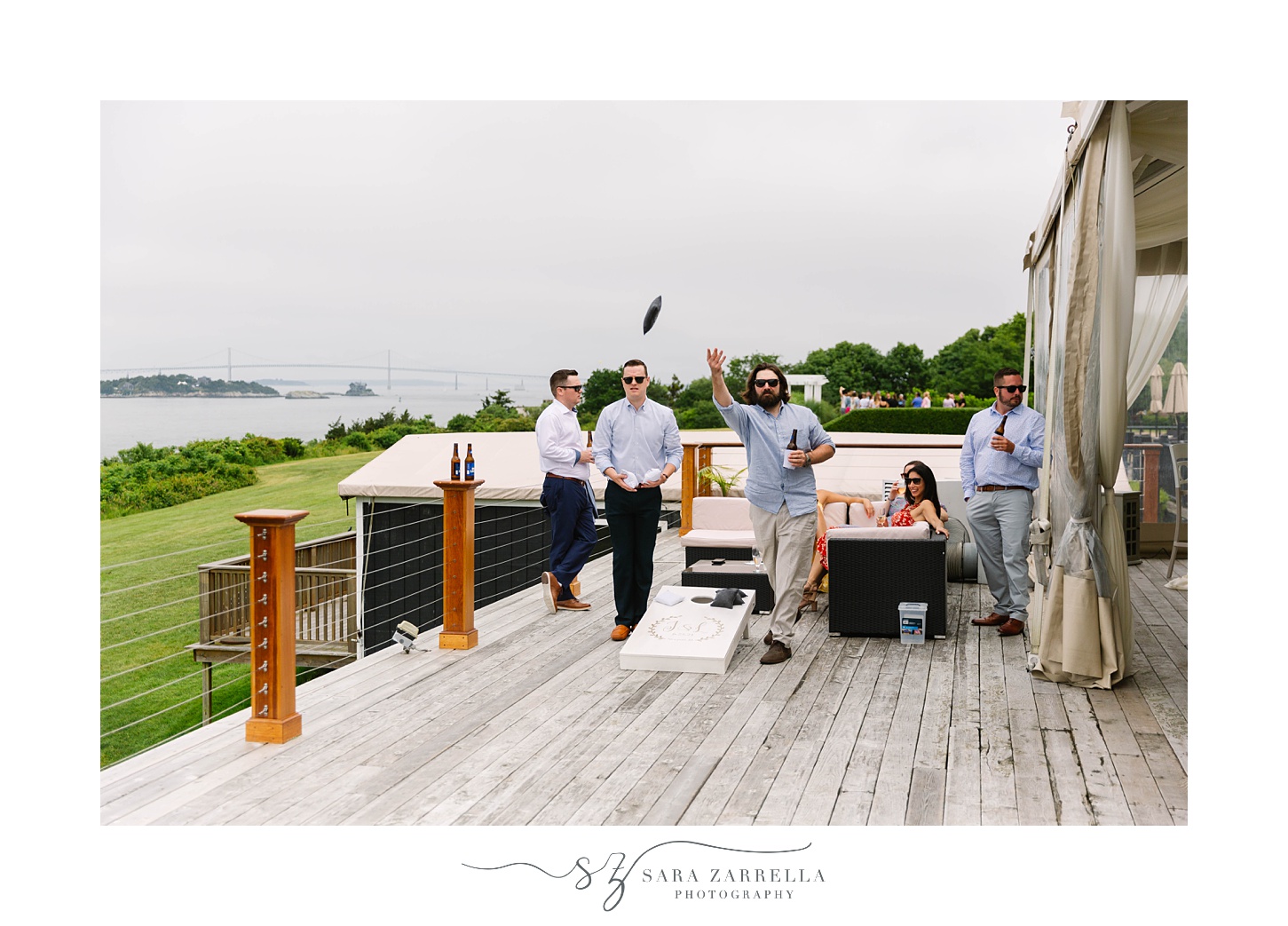 guests play corn hole during OceanCliff Hotel brunch wedding reception