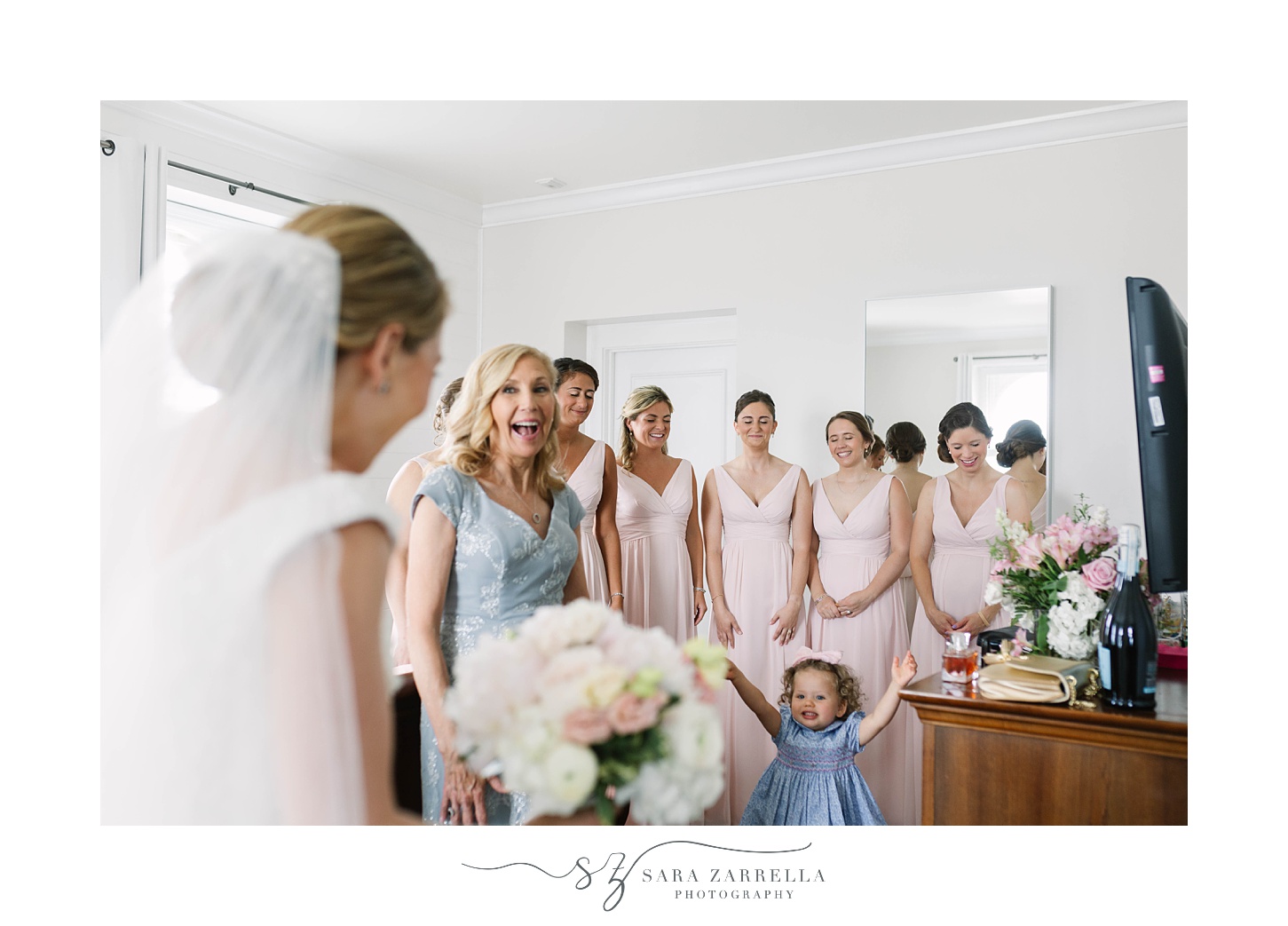 bridesmaids and mom see bride for first time during first look