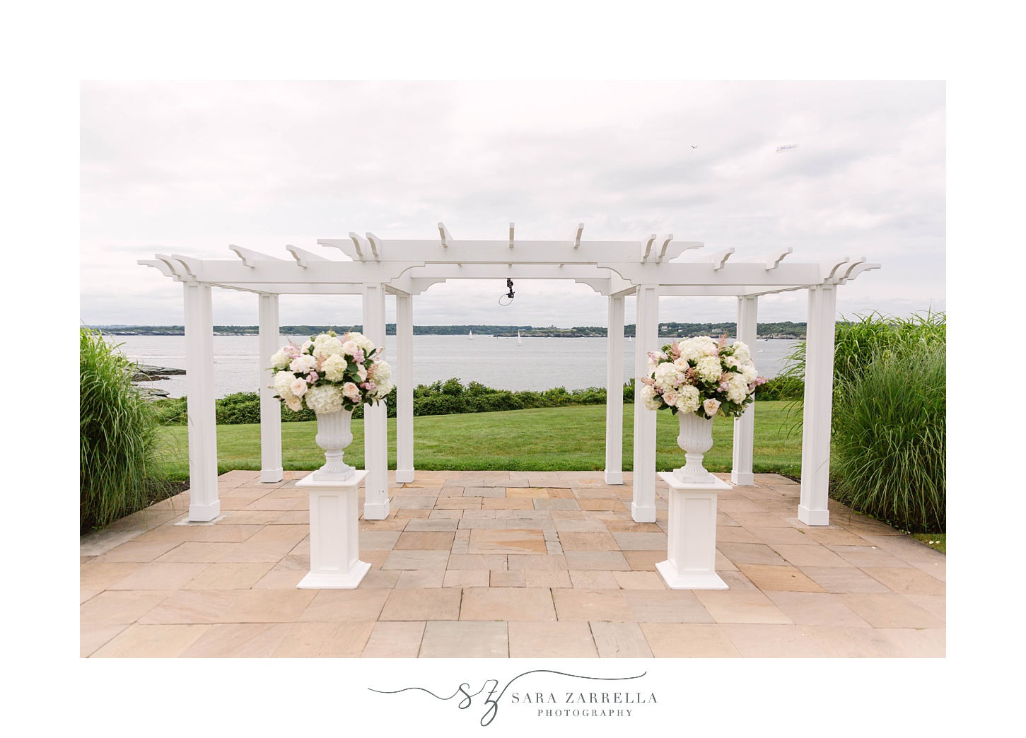 white arbor for waterfront ceremony for vow renewal at OceanCliff Hotel