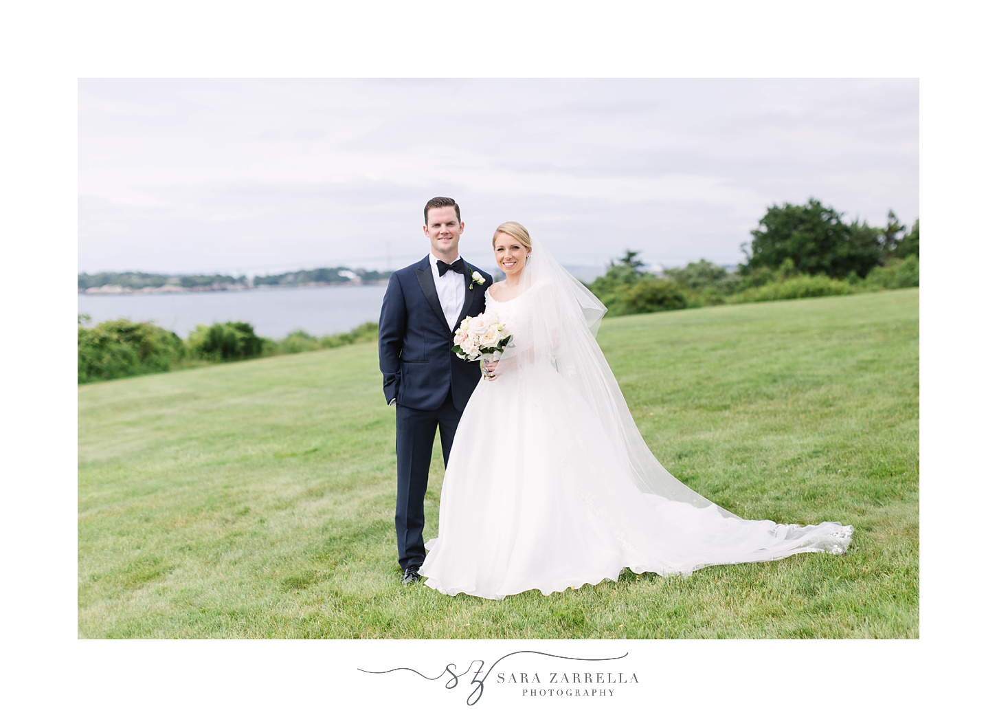 newlyweds pose along waterfront in Newport RI