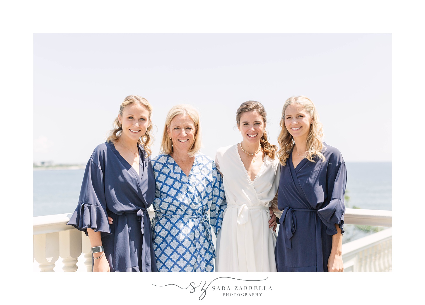 bride, mother and sisters pose on patio at The Chanler at Cliff Walk
