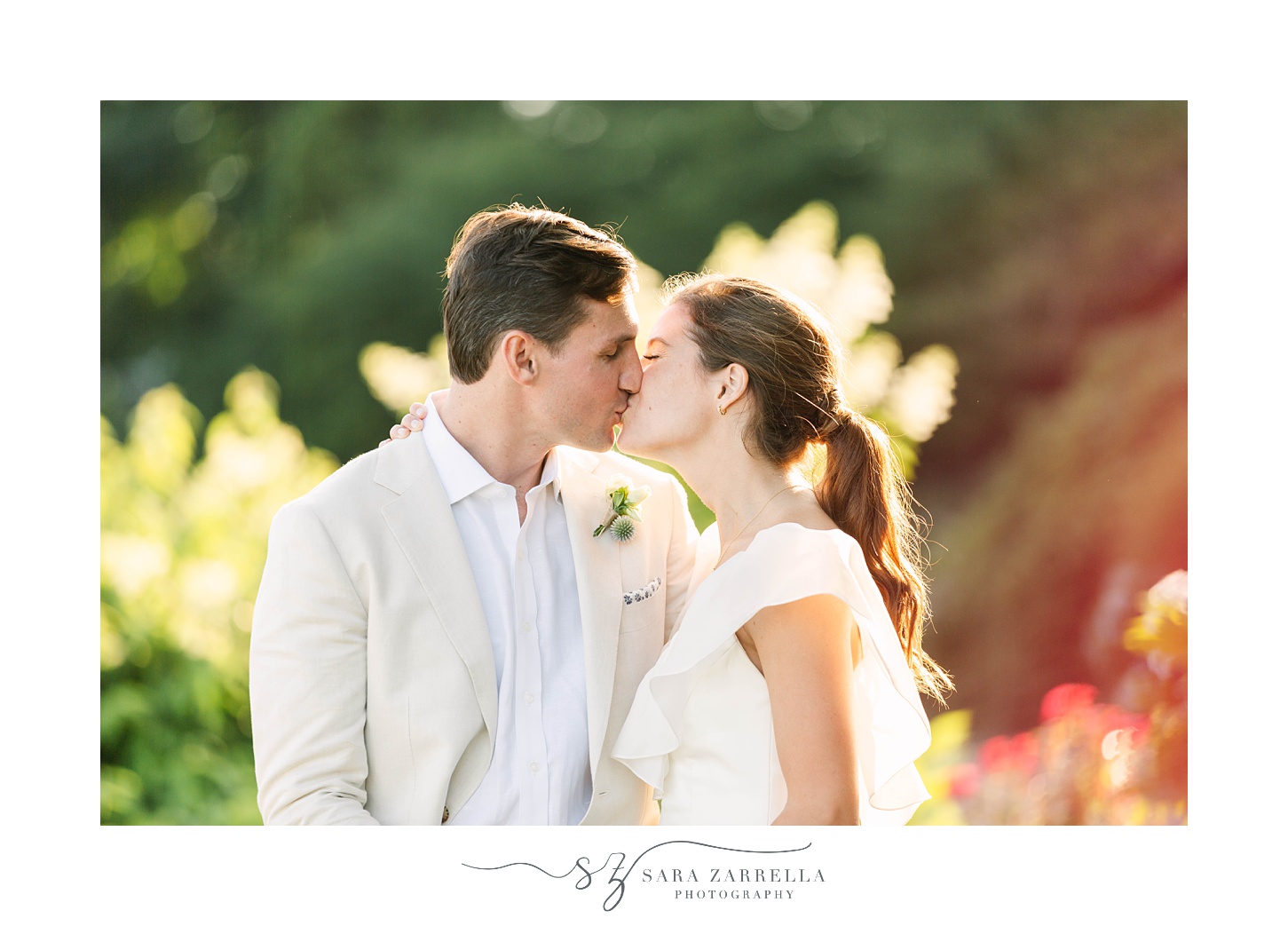 bride and groom kiss at The Chanler at Cliff Walk