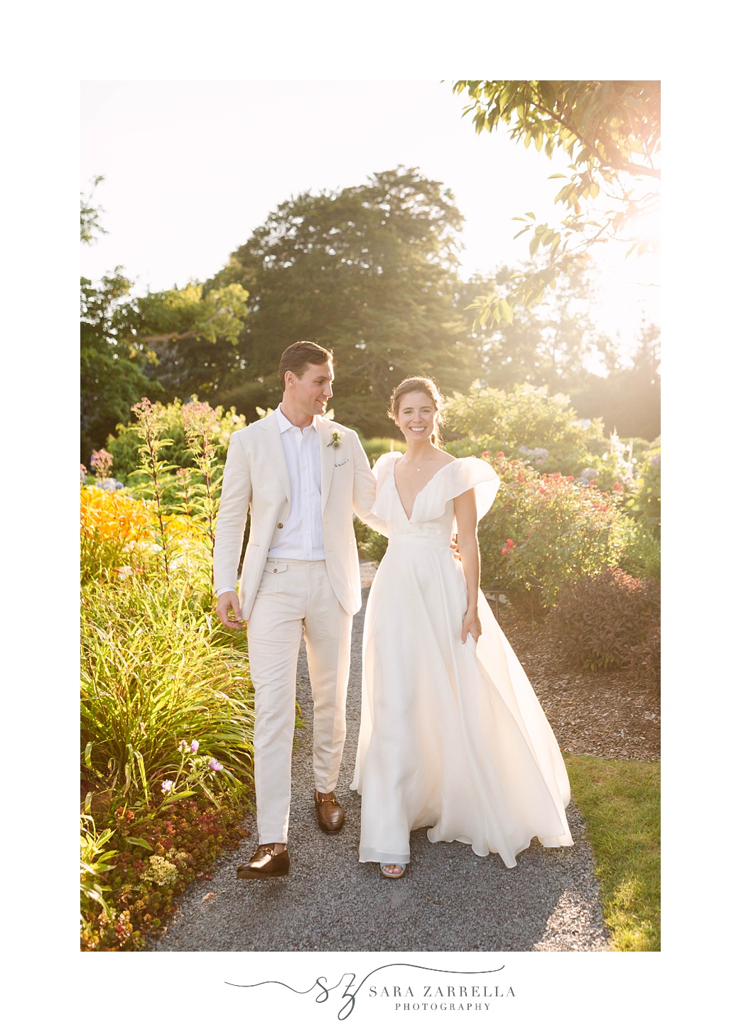 newlyweds walk through gardens in Newport RI