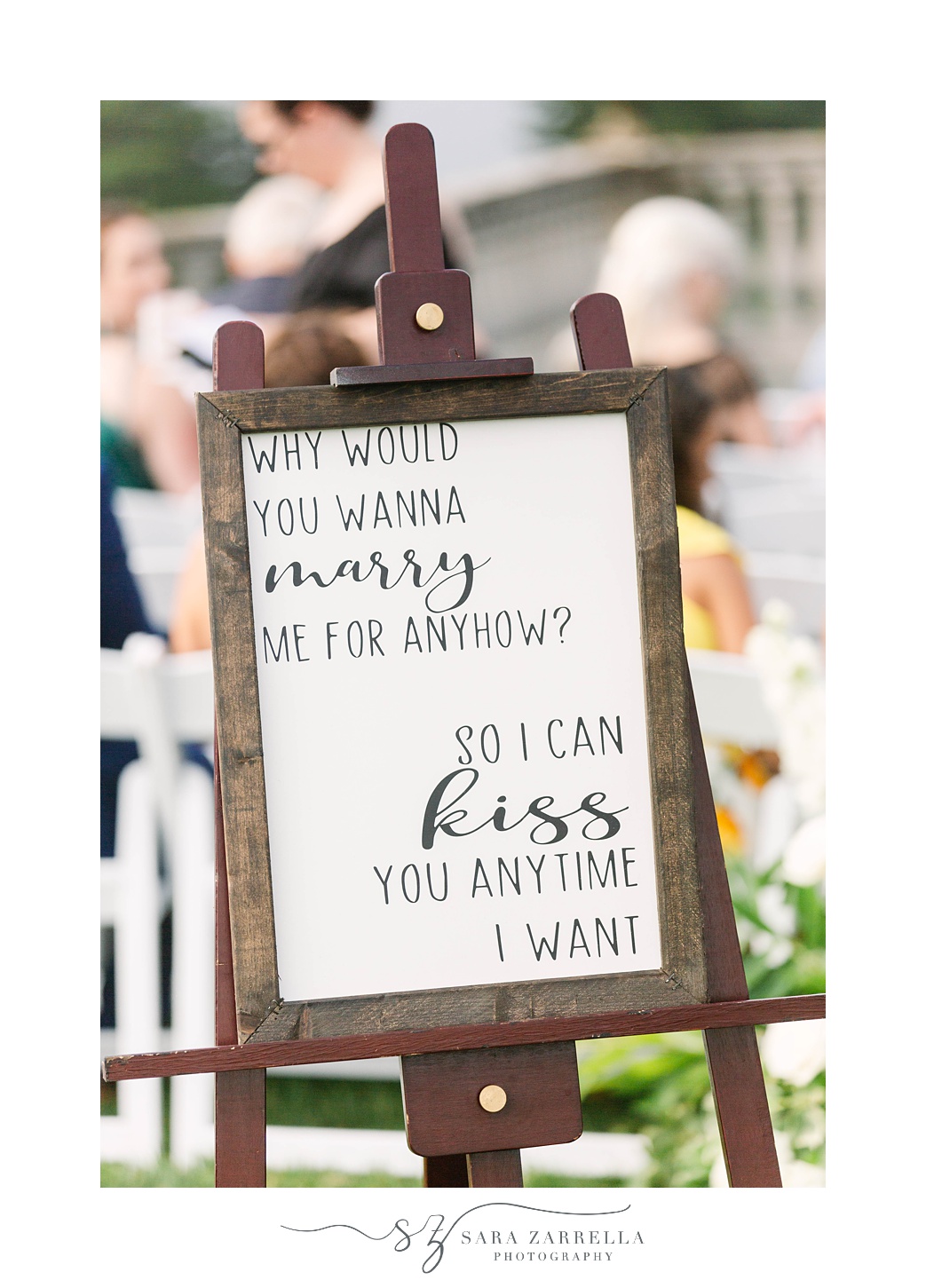 wooden welcome sign at waterfront wedding ceremony in Rhode Island