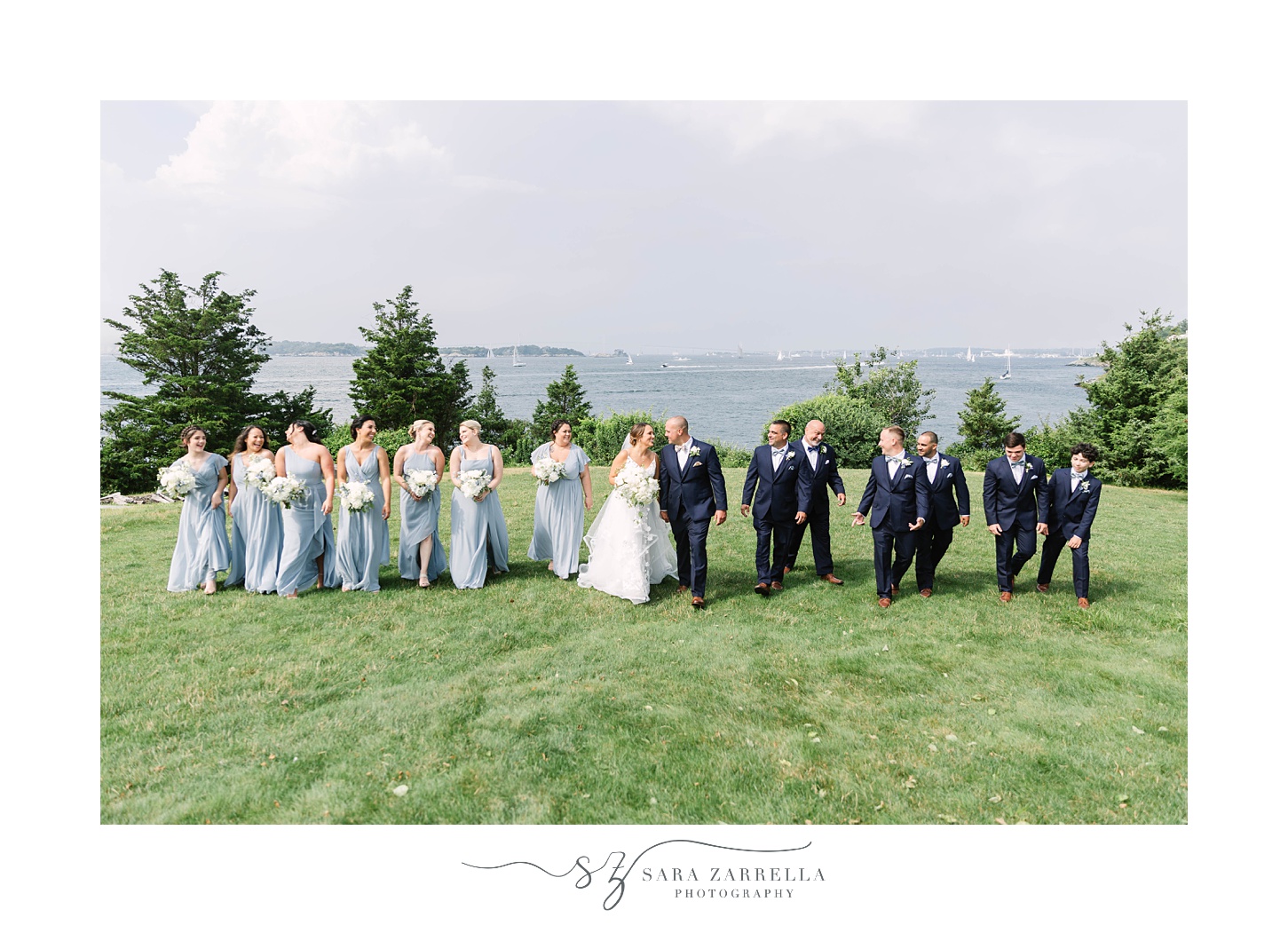 newlywed walk with wedding party at Castle Hill Inn