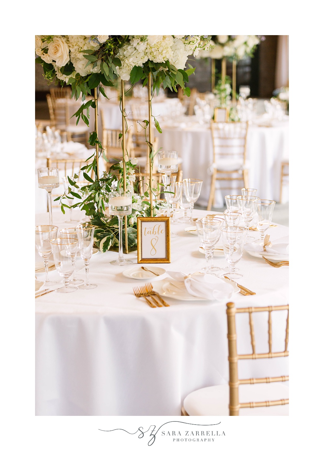 tented wedding reception at Castle Hill Inn with white and gold details