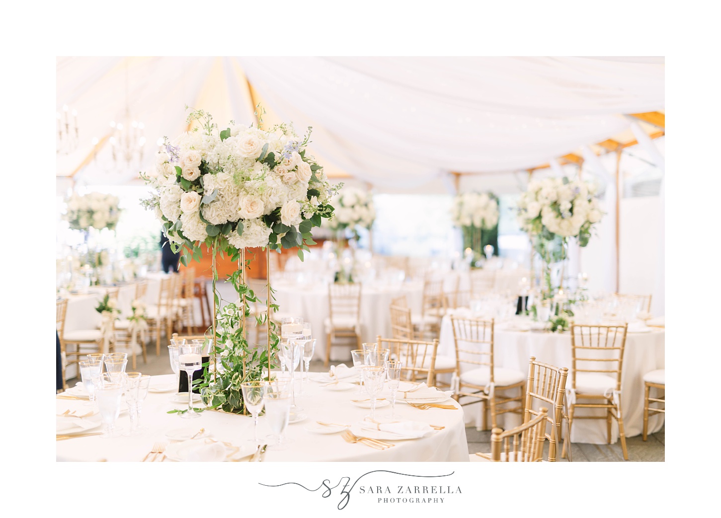 tented wedding reception at Castle Hill Inn with white and gold details