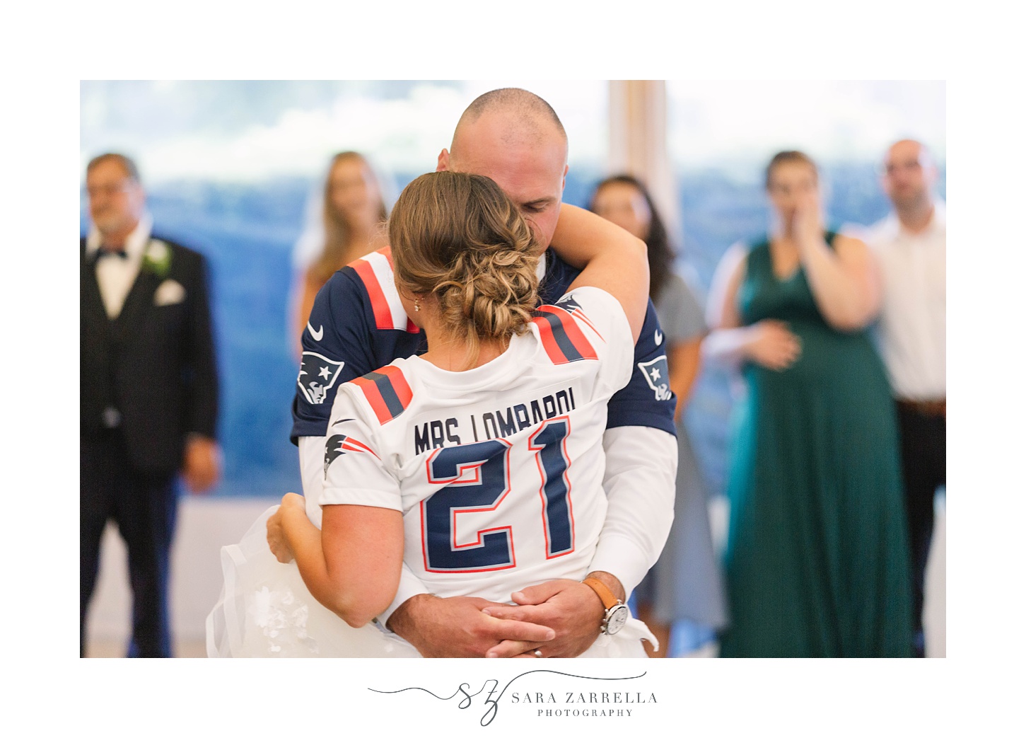 bride and groom dance in custom Patriots jerseys at Newport RI wedding reception
