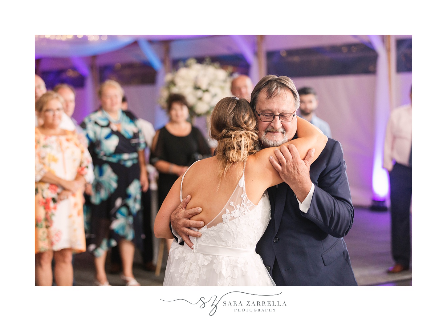 bride and dad hug during Newport RI wedding reception