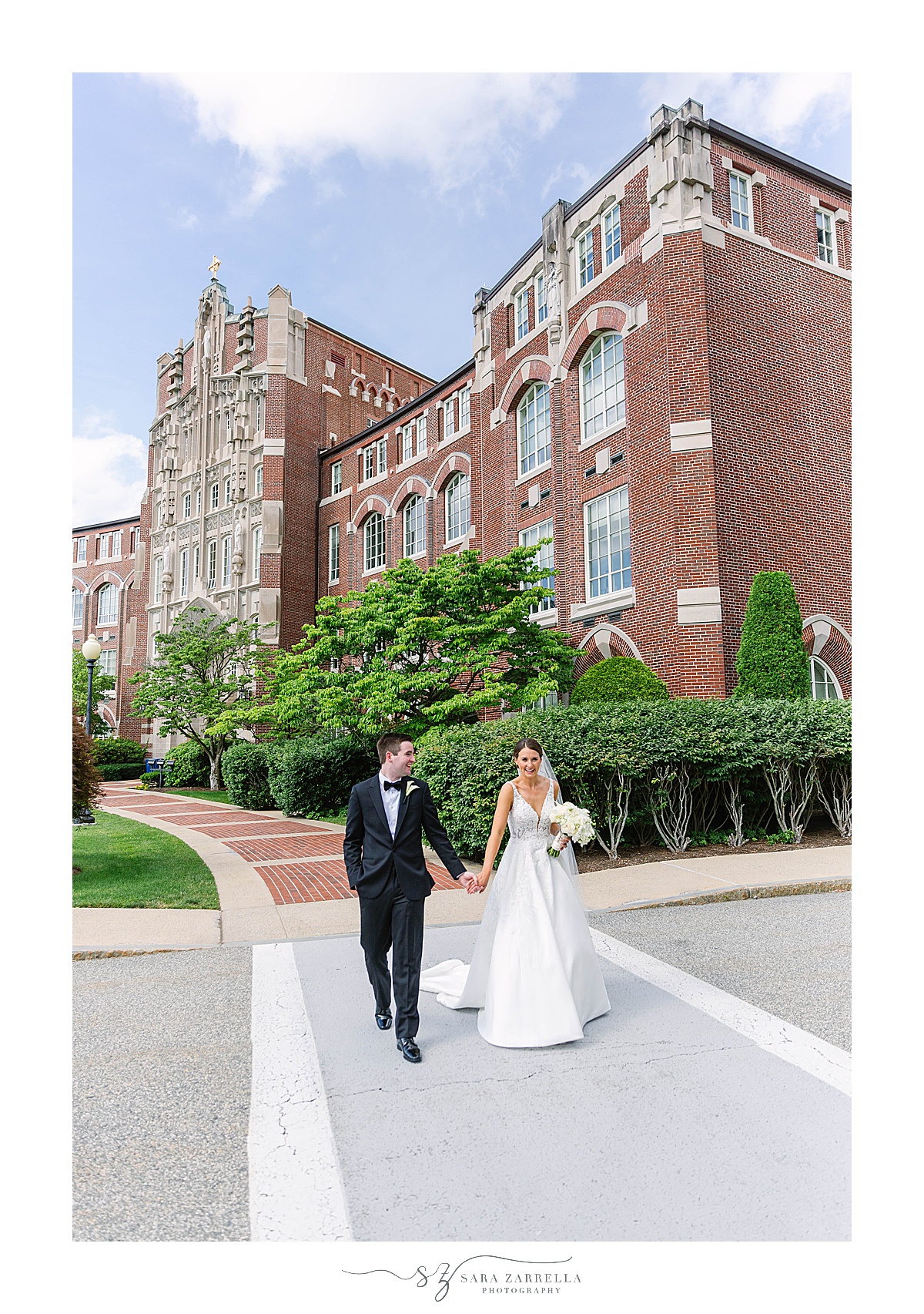 bride and groom walk through Providence College