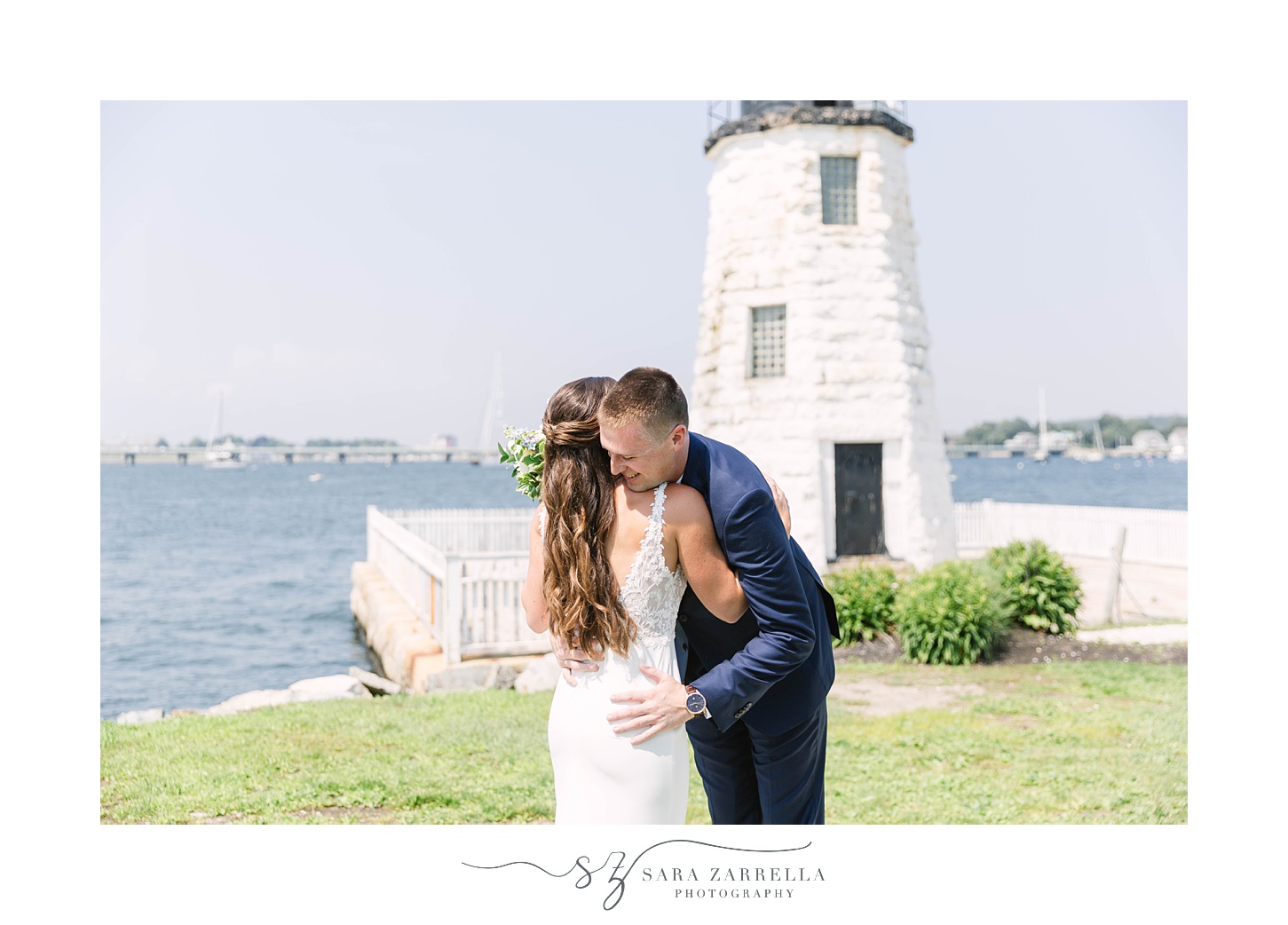 bride and groom have first look by lighthouse in Newport RI