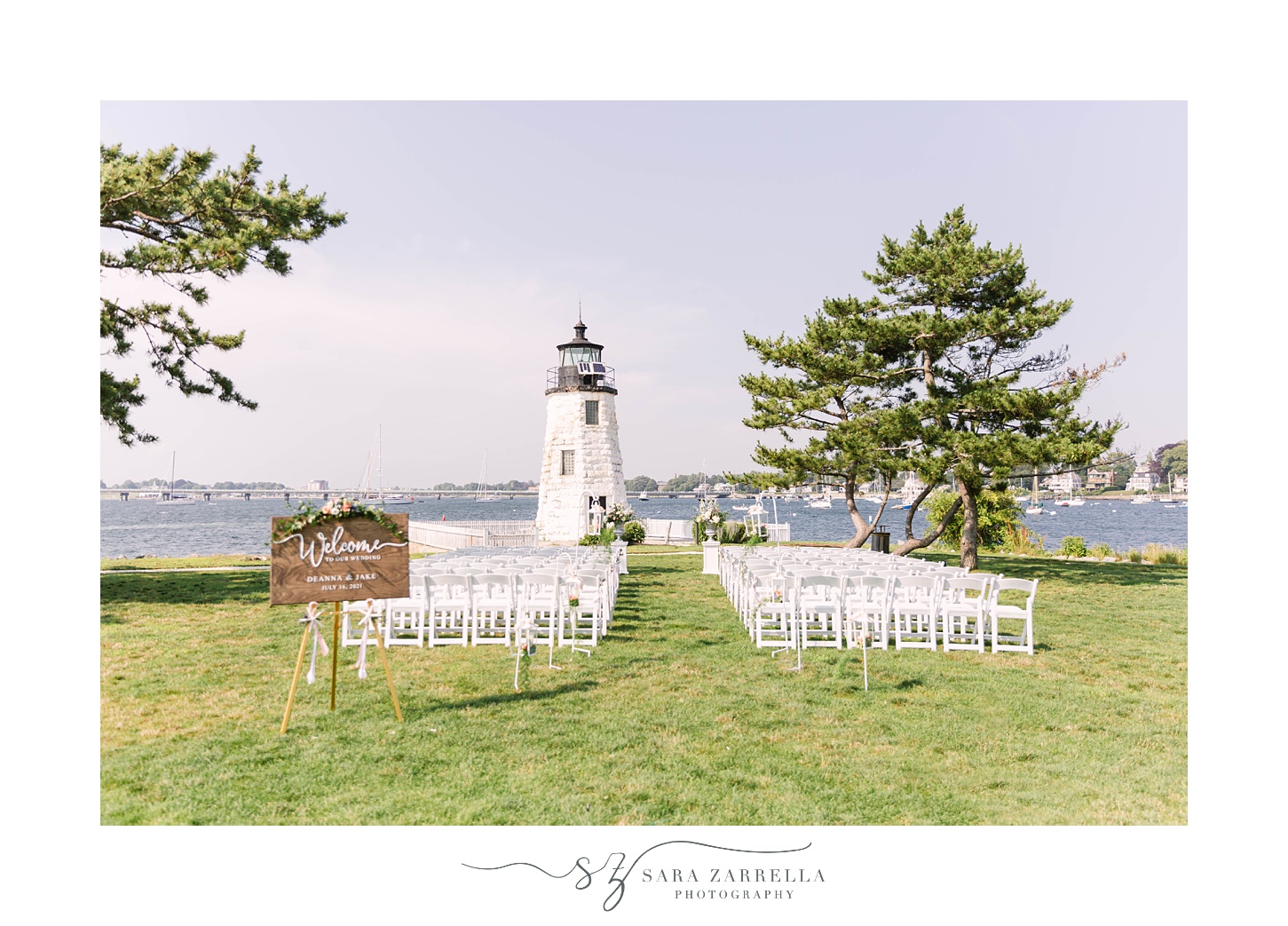 wedding ceremony on lawn at Gurney's Newport Resort with lighthouse in background
