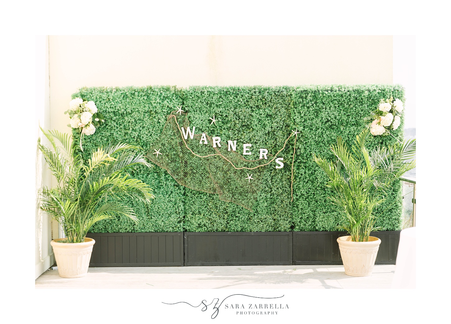 greenery wall with couple's last name for Newport RI wedding reception