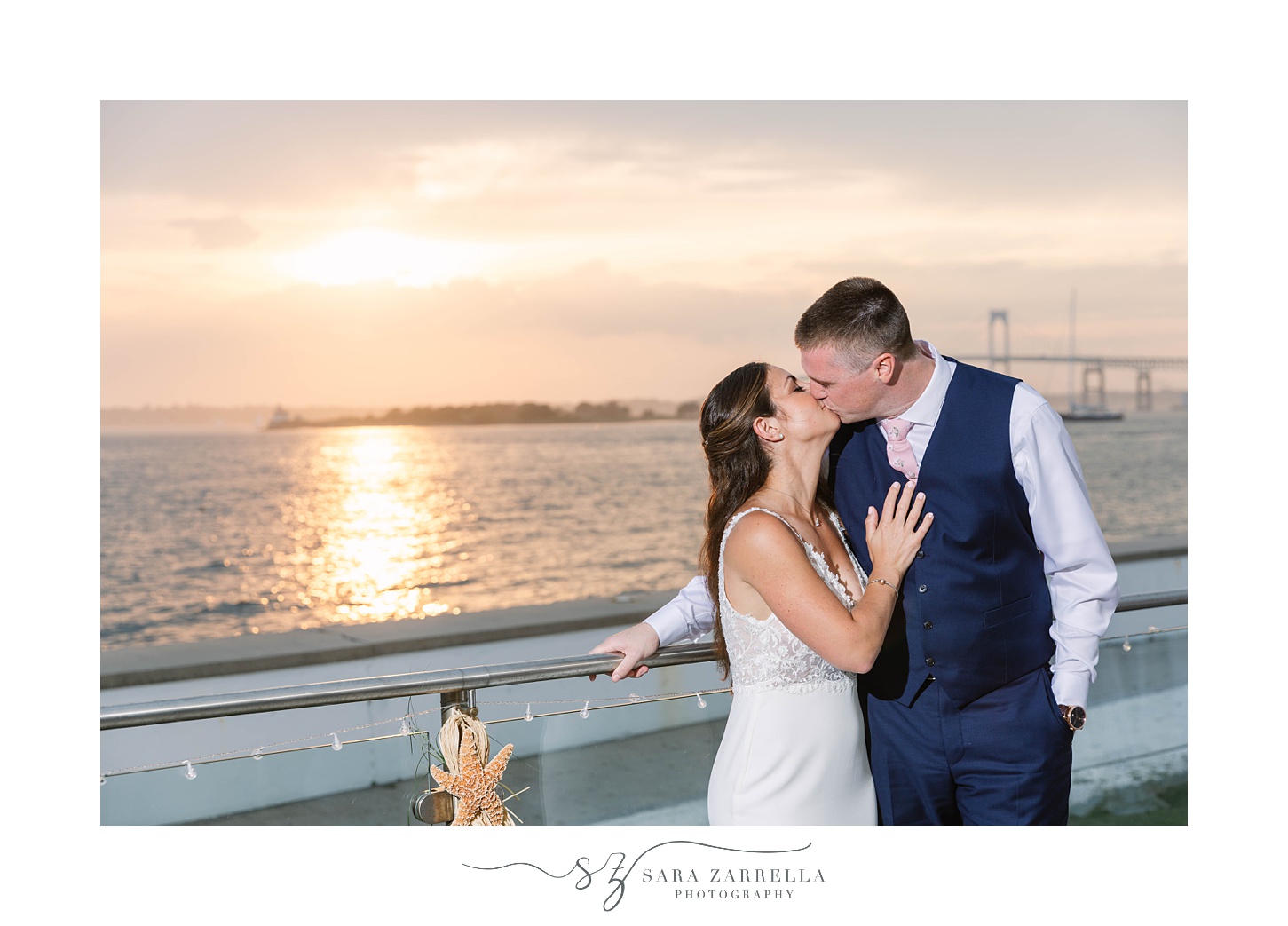 bride and groom kiss on balcony at Gurney's Newport Resort 
