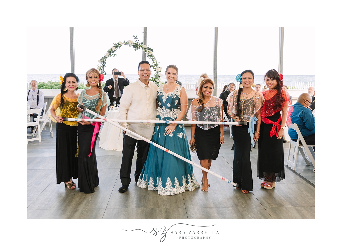 newlyweds pose with traditional filipino dancers during Mashpee MA reception