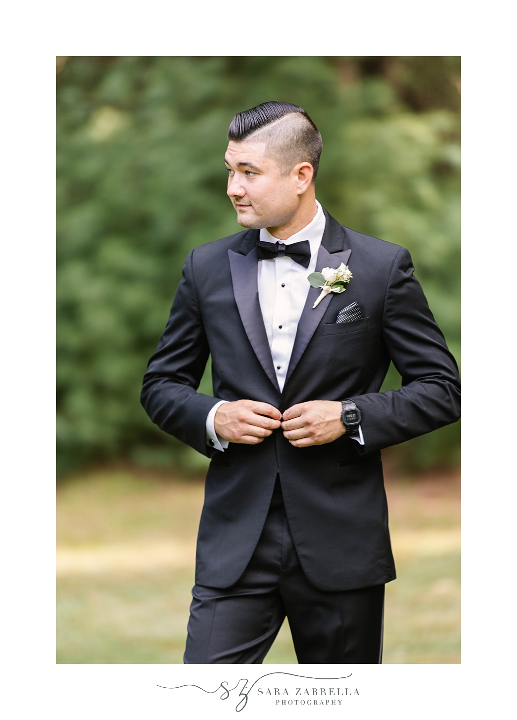 groom buttons on classic tux jacket before Lakeview Pavilion wedding