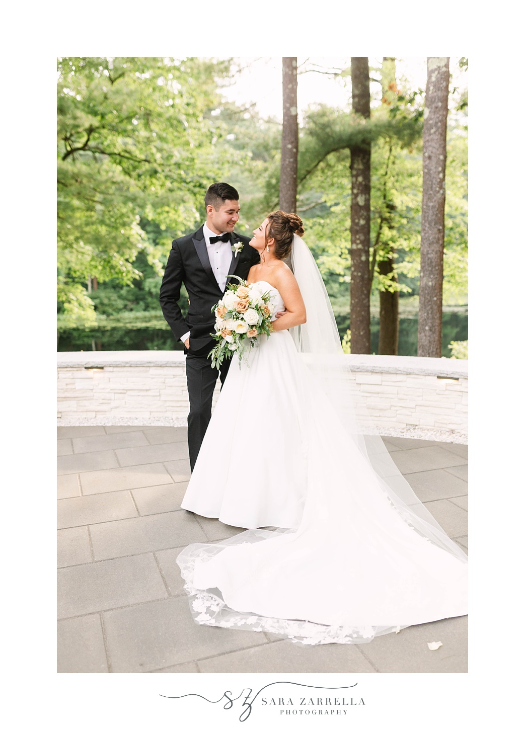 bride and groom stand together on patio at Lakeview Pavilion
