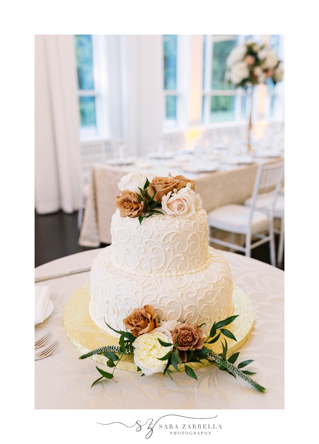 tiered wedding cake with muted flowers