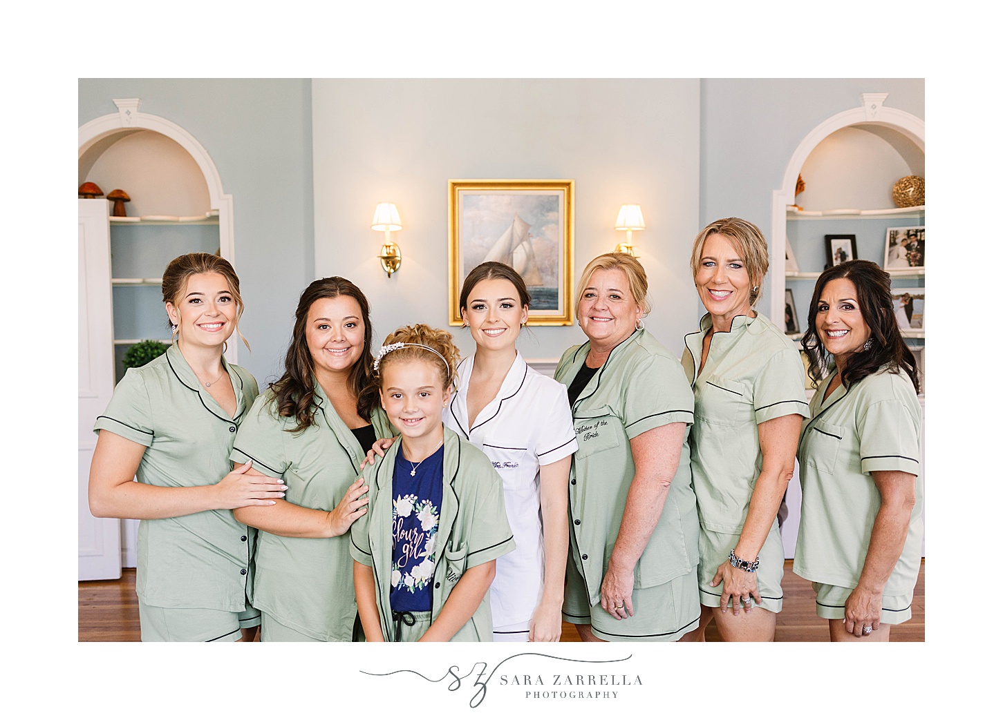 bride prepares with bridesmaids in pale green robes before RI wedding day
