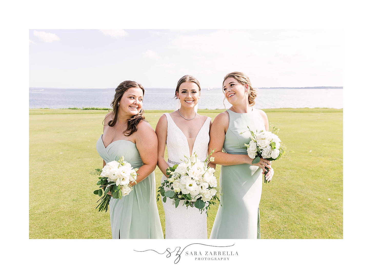 bride and bridesmaids smile together during wedding portraits  at Warwick Country Club