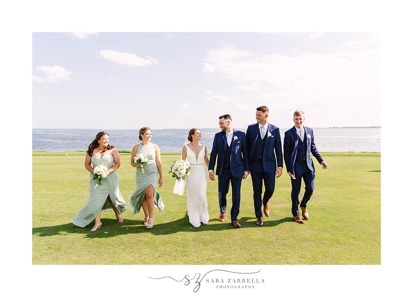 bridal party walks with bride and groom