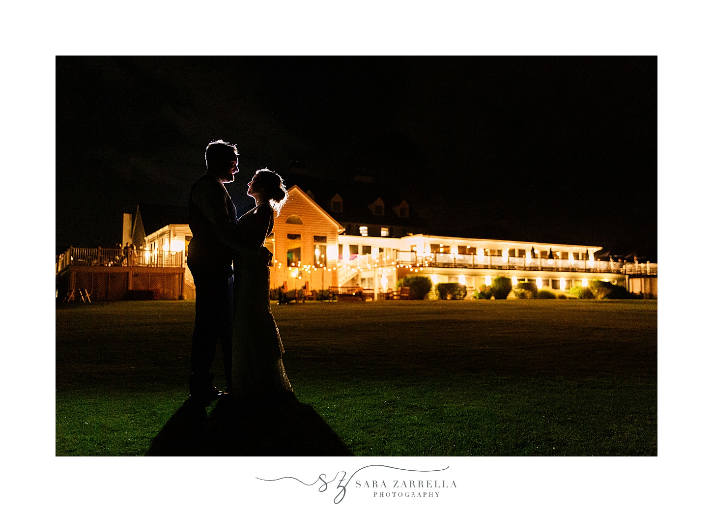 bride and groom hug during nighttime portraits at Warwick Country Club