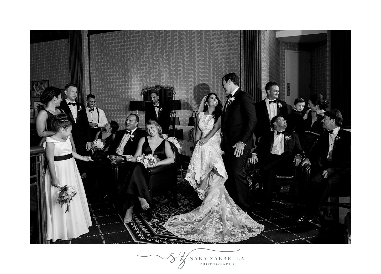 bride and groom pose with wedding party at  Quidnessett Country Club