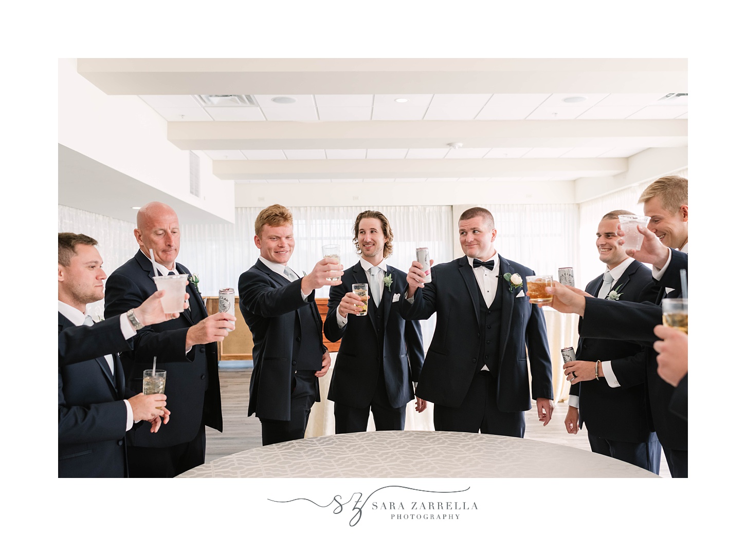 groom toasts with groomsmen before RI wedding