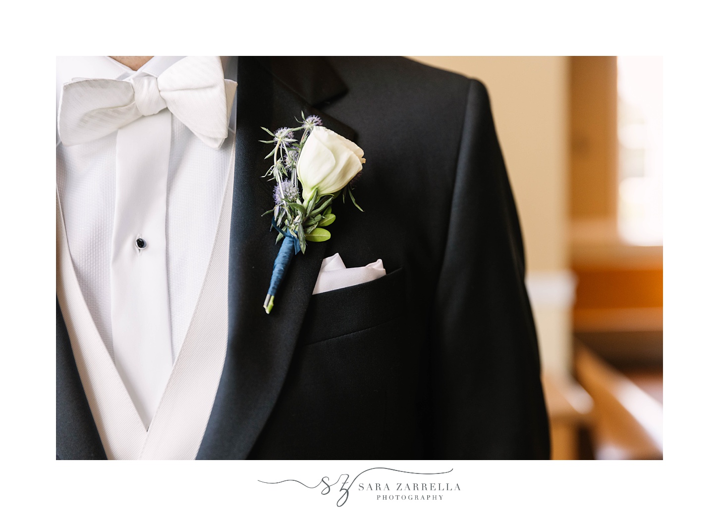groom's black tux and white boutonnière