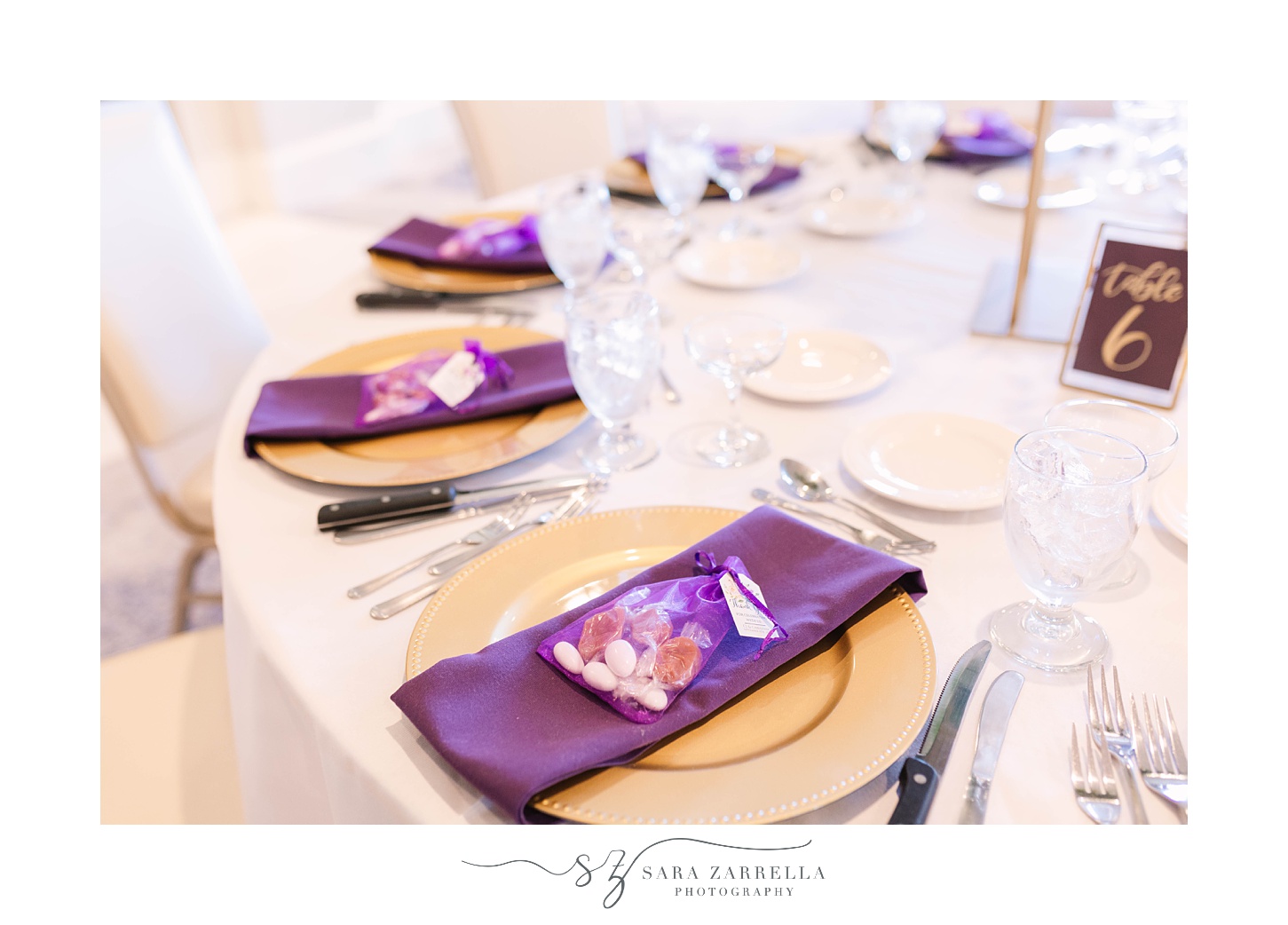 place settings with purple napkins for fall wedding at Quidnessett Country Club