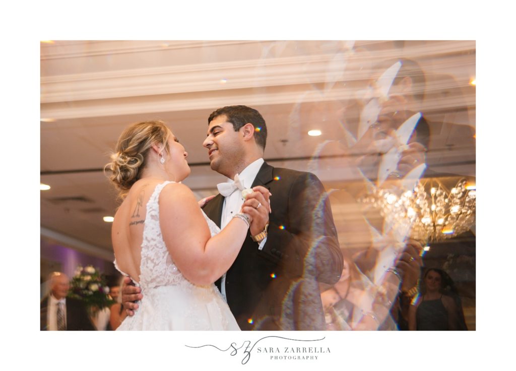 bride and groom dance together during North Kingstown RI wedding reception 