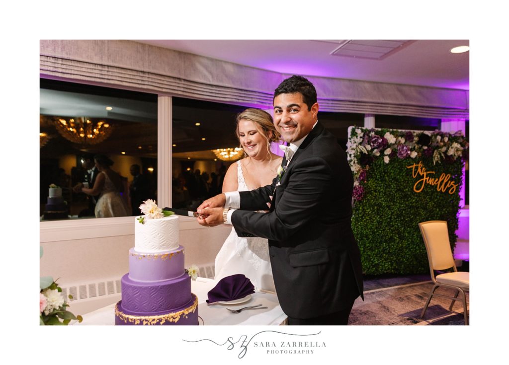 bride and groom cut wedding cake at North Kingstown RI wedding reception 