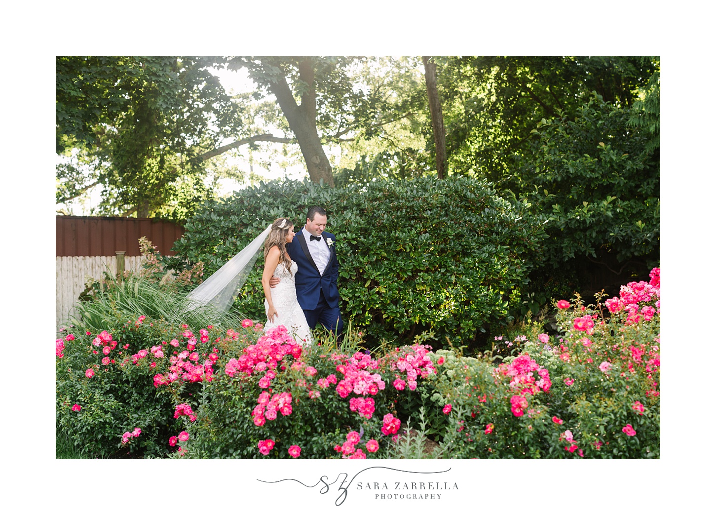 bride and groom walk through gardens at Kirkbrae Country Club