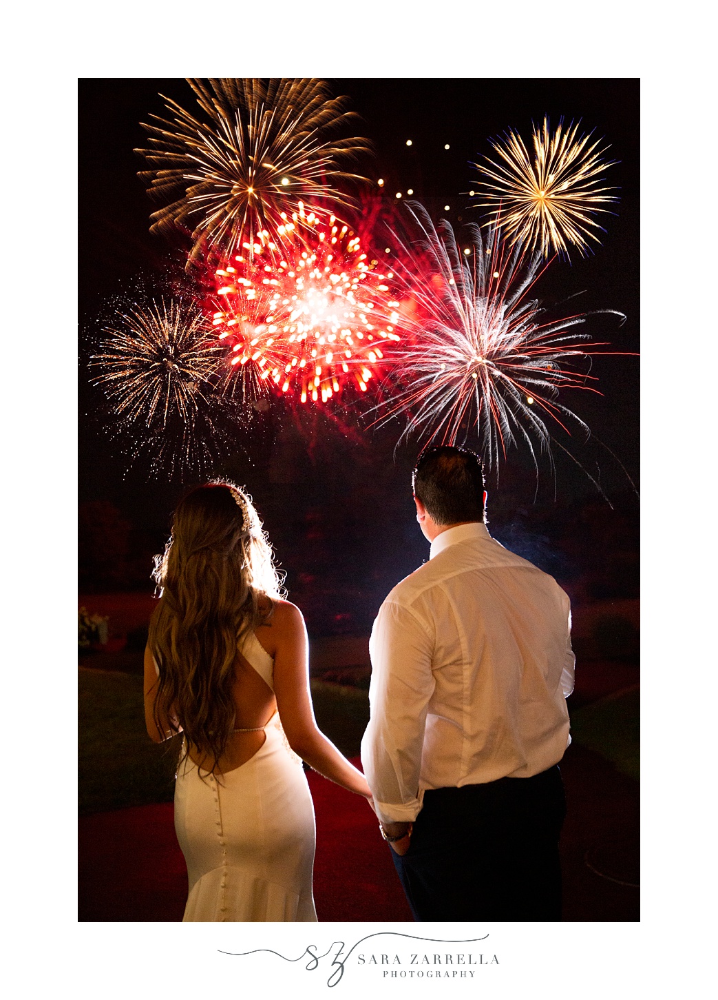couple watches fireworks after Kirkbrae Country Club wedding