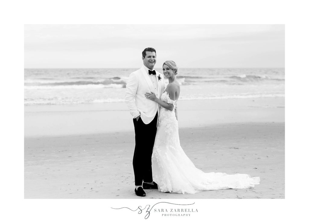 husband and wife pose along Narragansett Bay